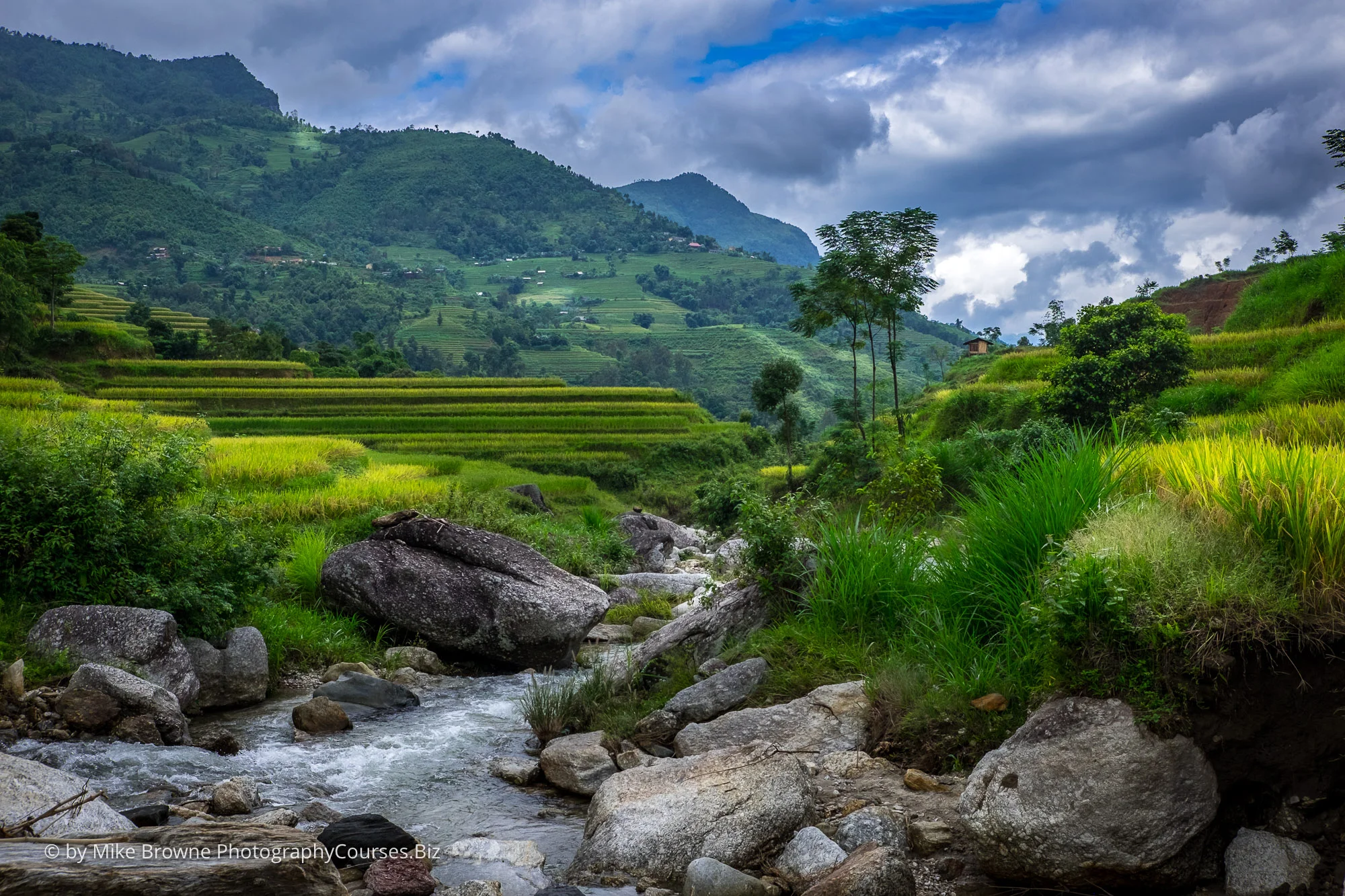 stream leading through hills and rice fields in mountains of north Vietnam