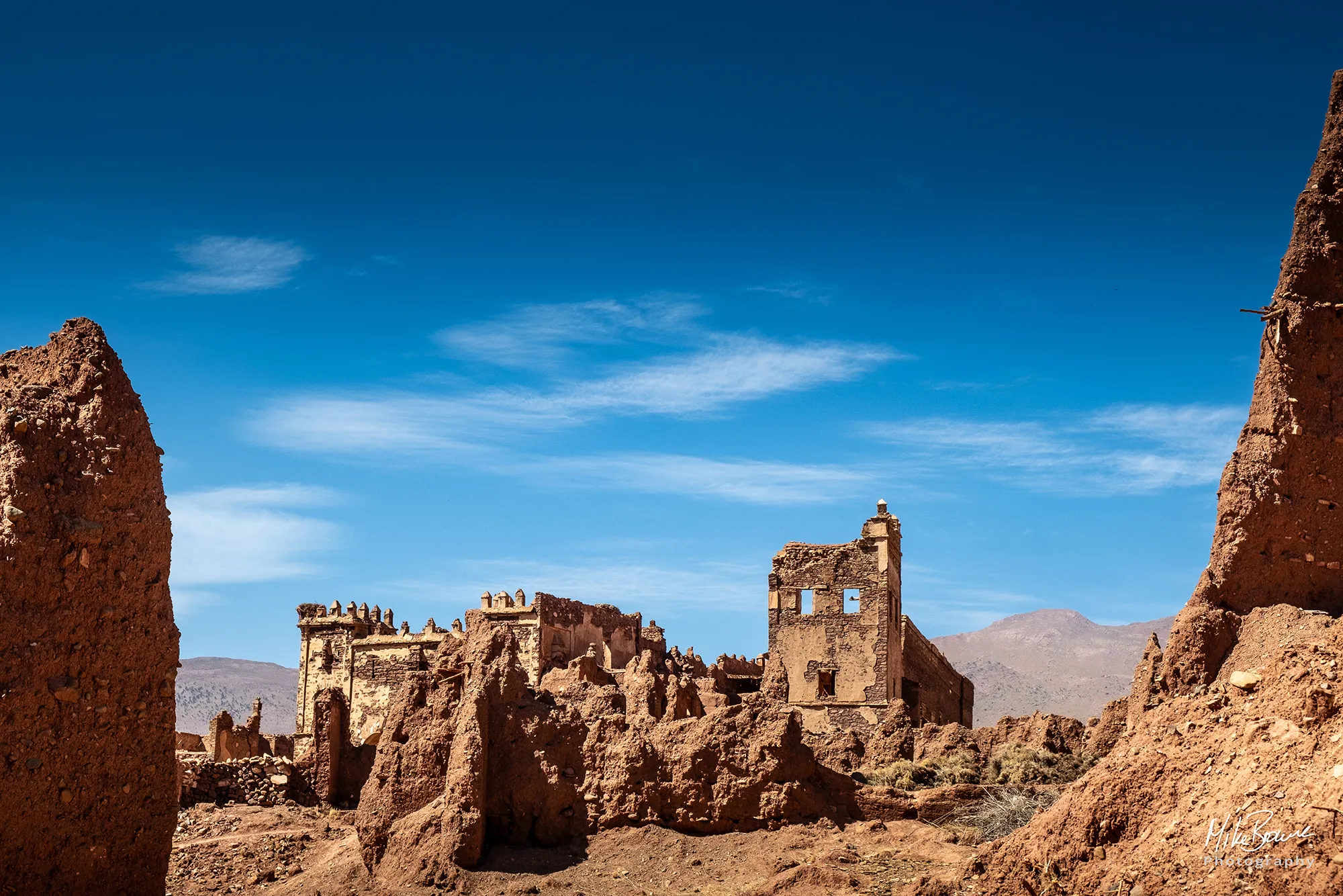 Ruins of an ancient Kasbah and a clear blue sky in Morocco