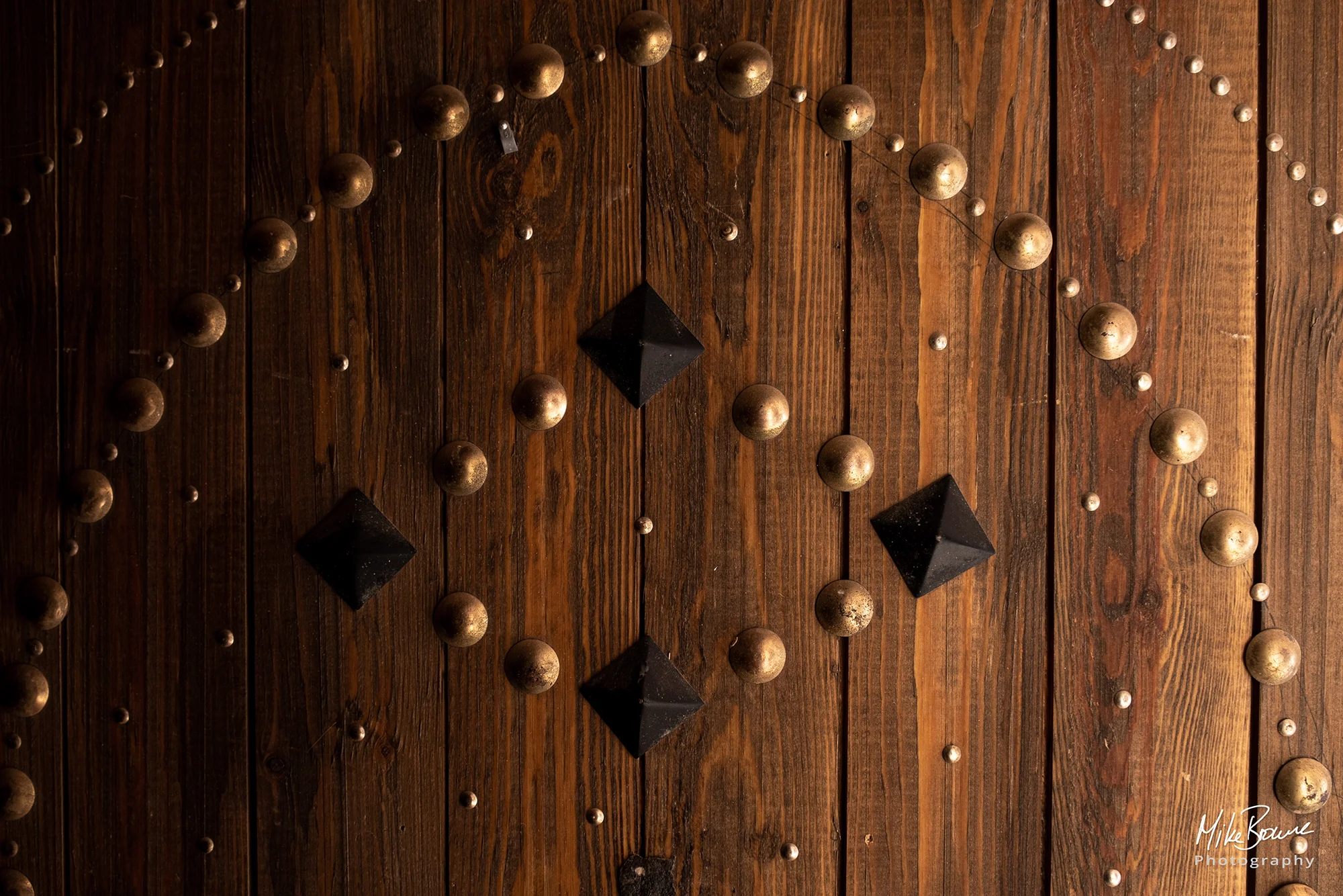 Ornate stud work on an old wooden door