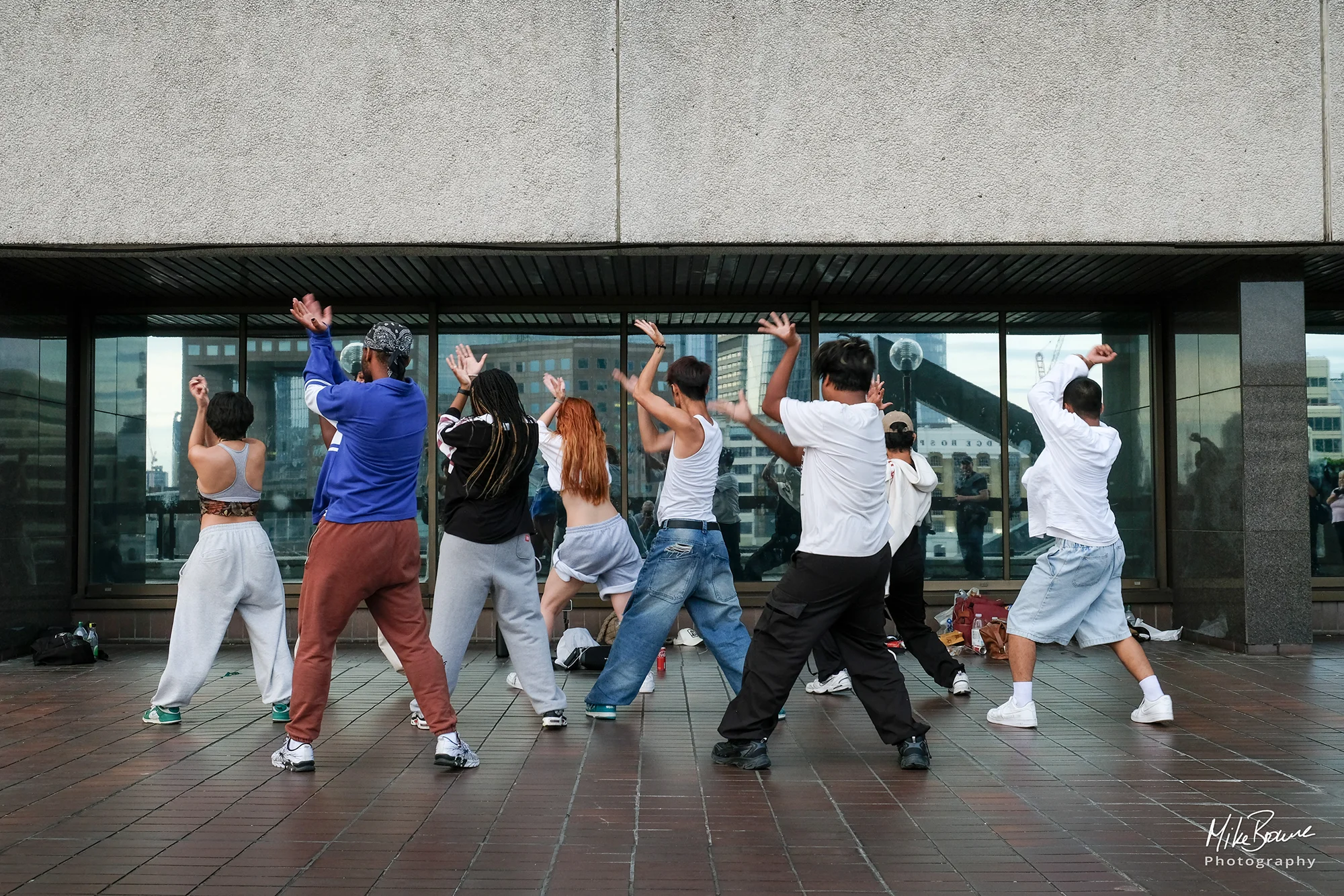 London kids using office windows as mirror as they practise a dance routine