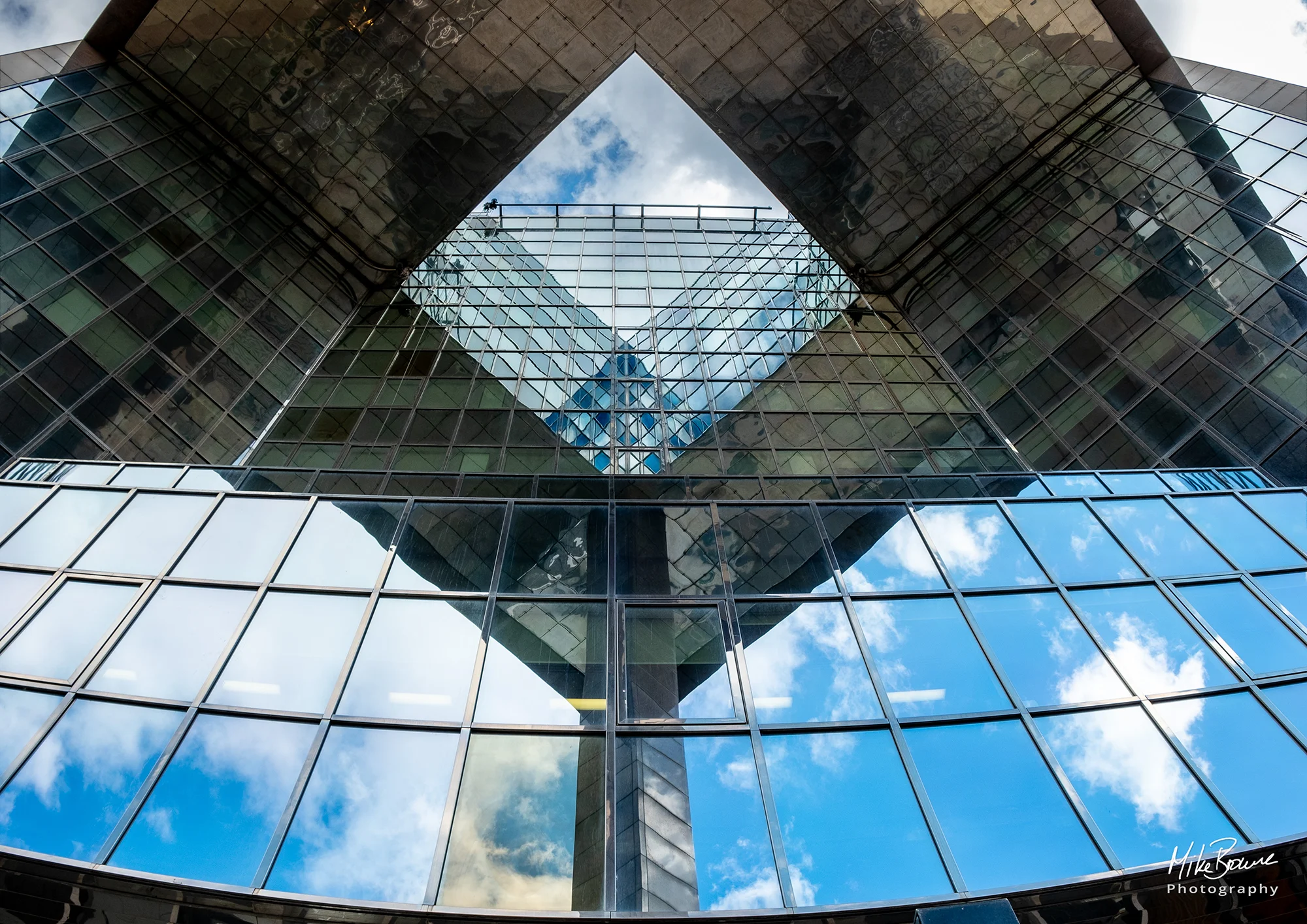 Diamond shaped reflection on glass building in London