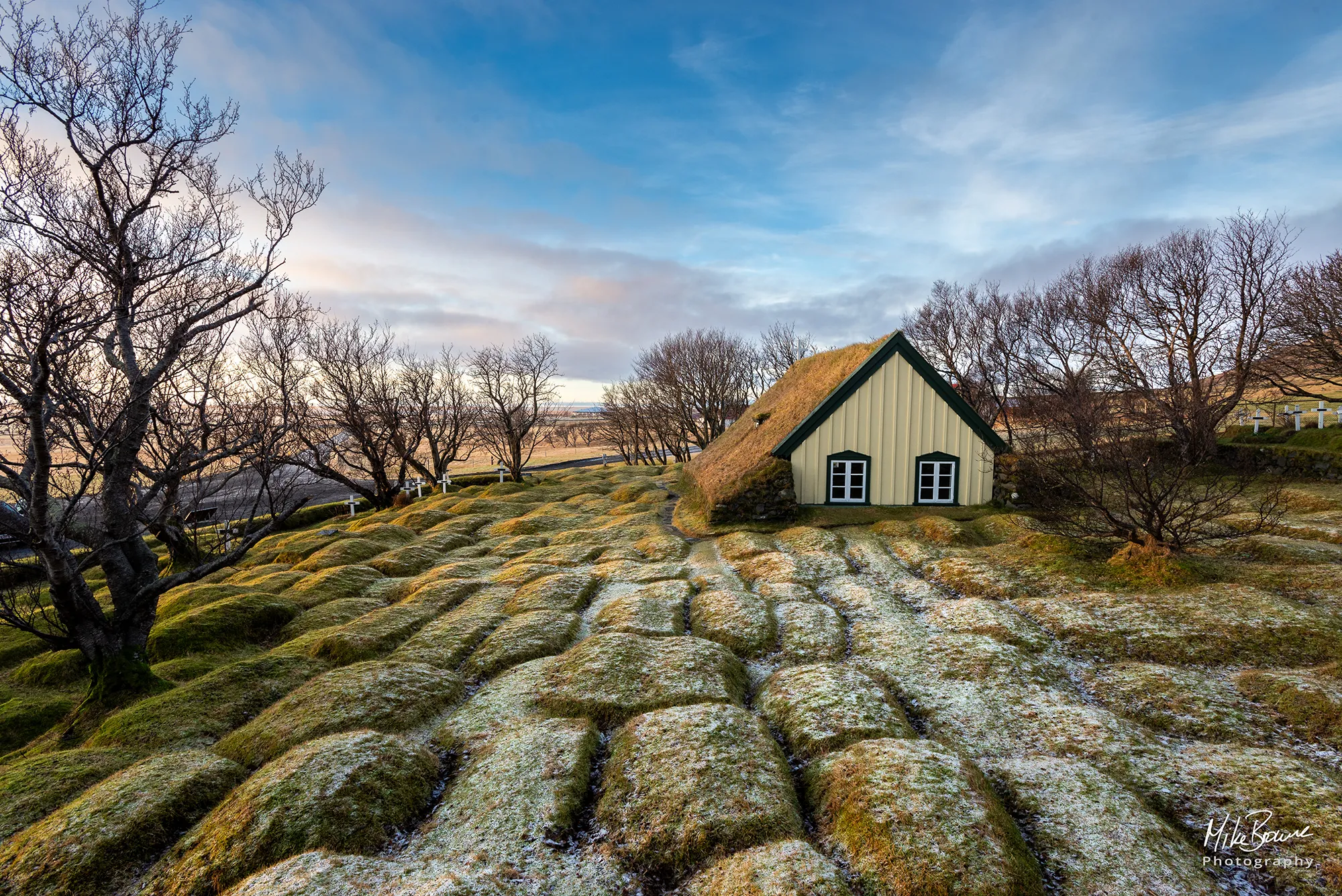 Frost covered graves at small church on south coast of Iceland