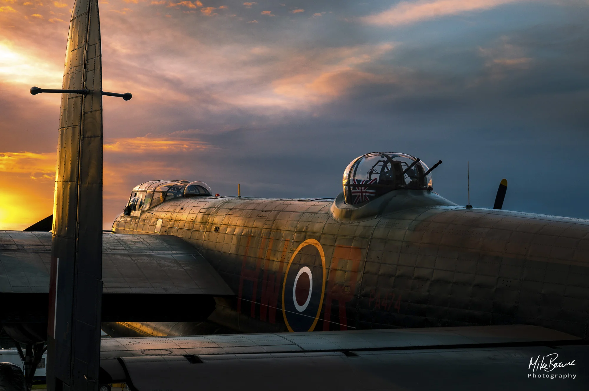 Avro Lancaster bomber facing into the setting sun