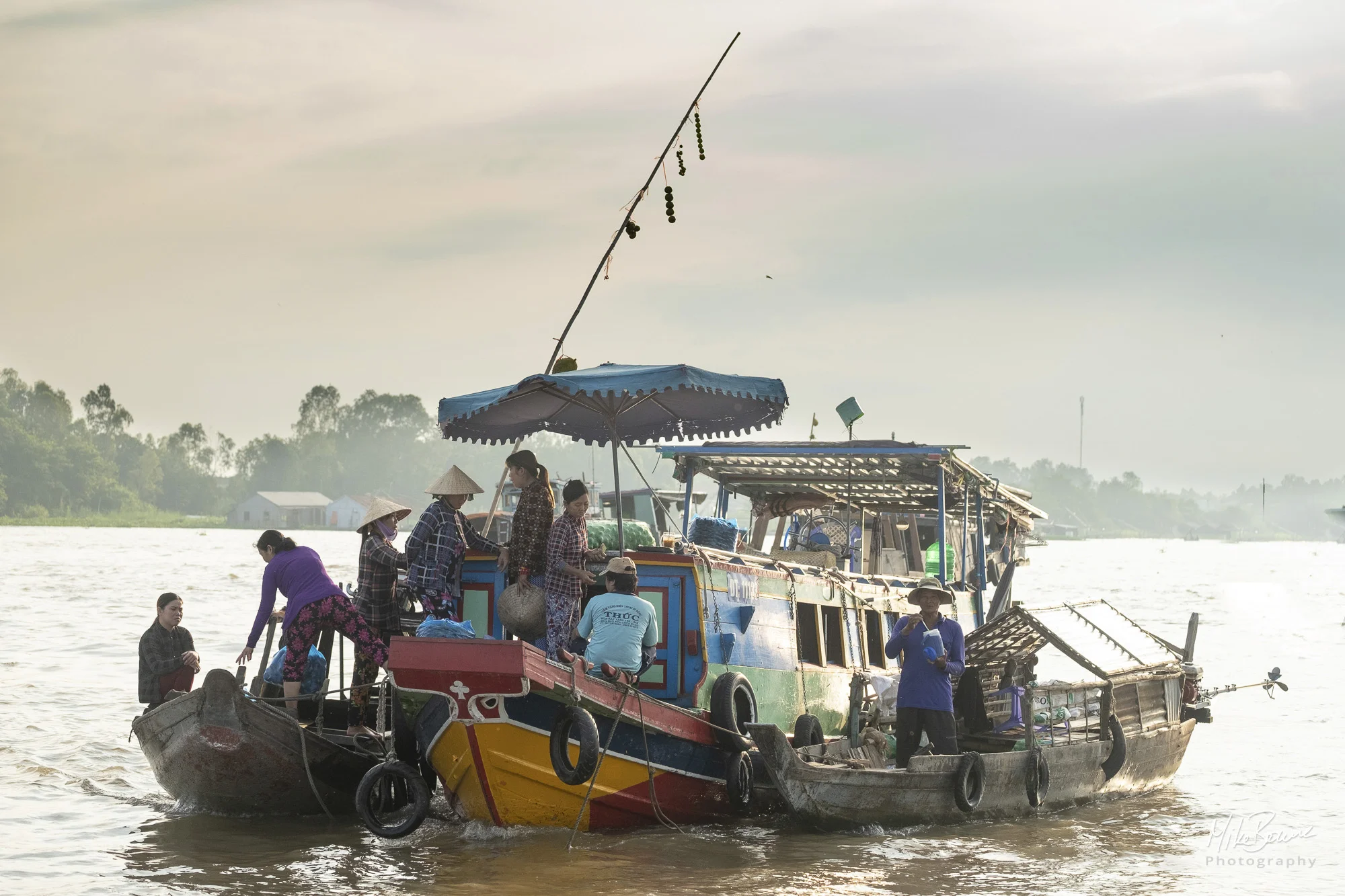 Three trader boats on Mekong rover at Châu Đốc floating market, Vietnam