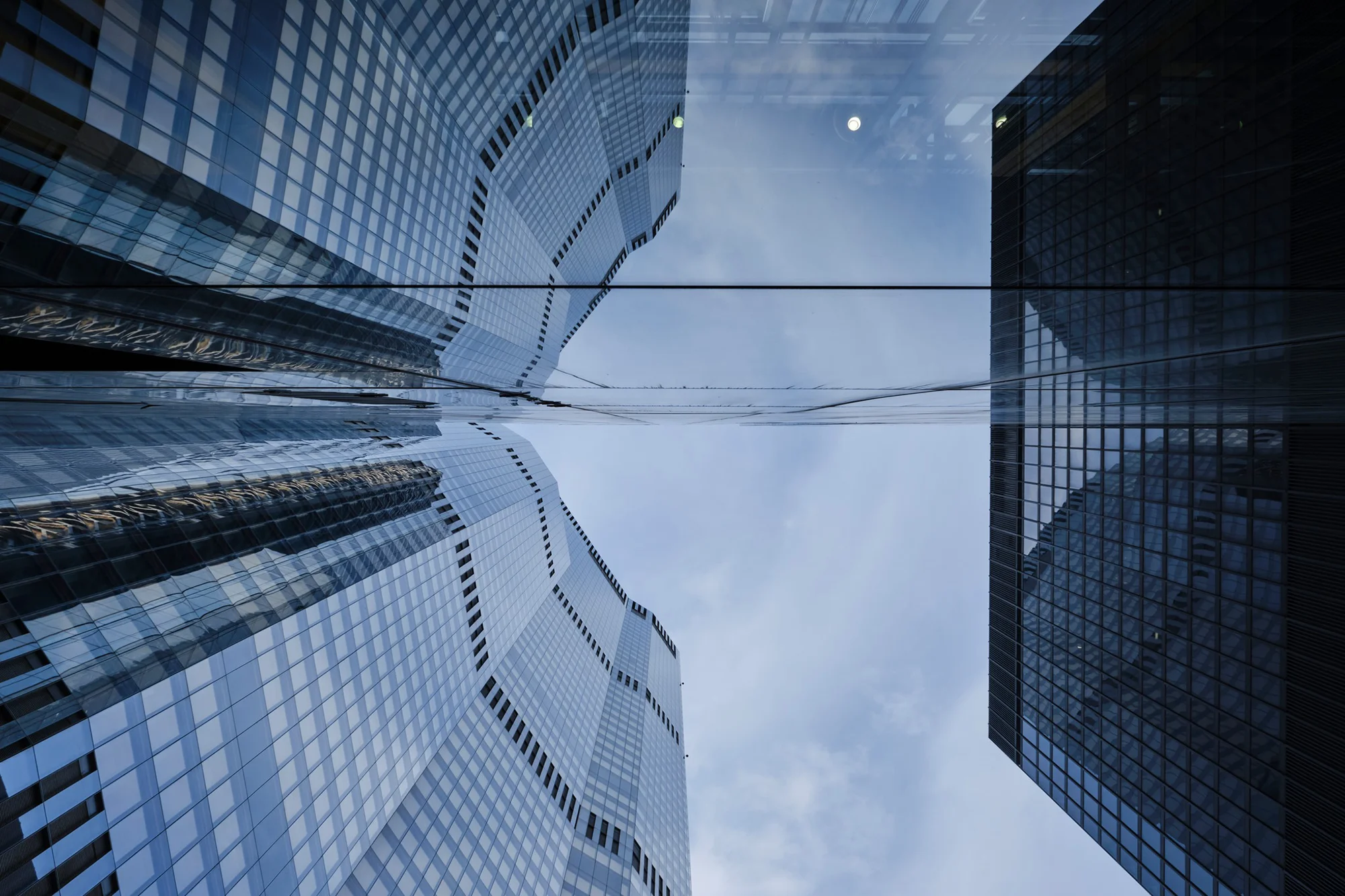 Abstract reflections of London city sky scrapers in a glass window