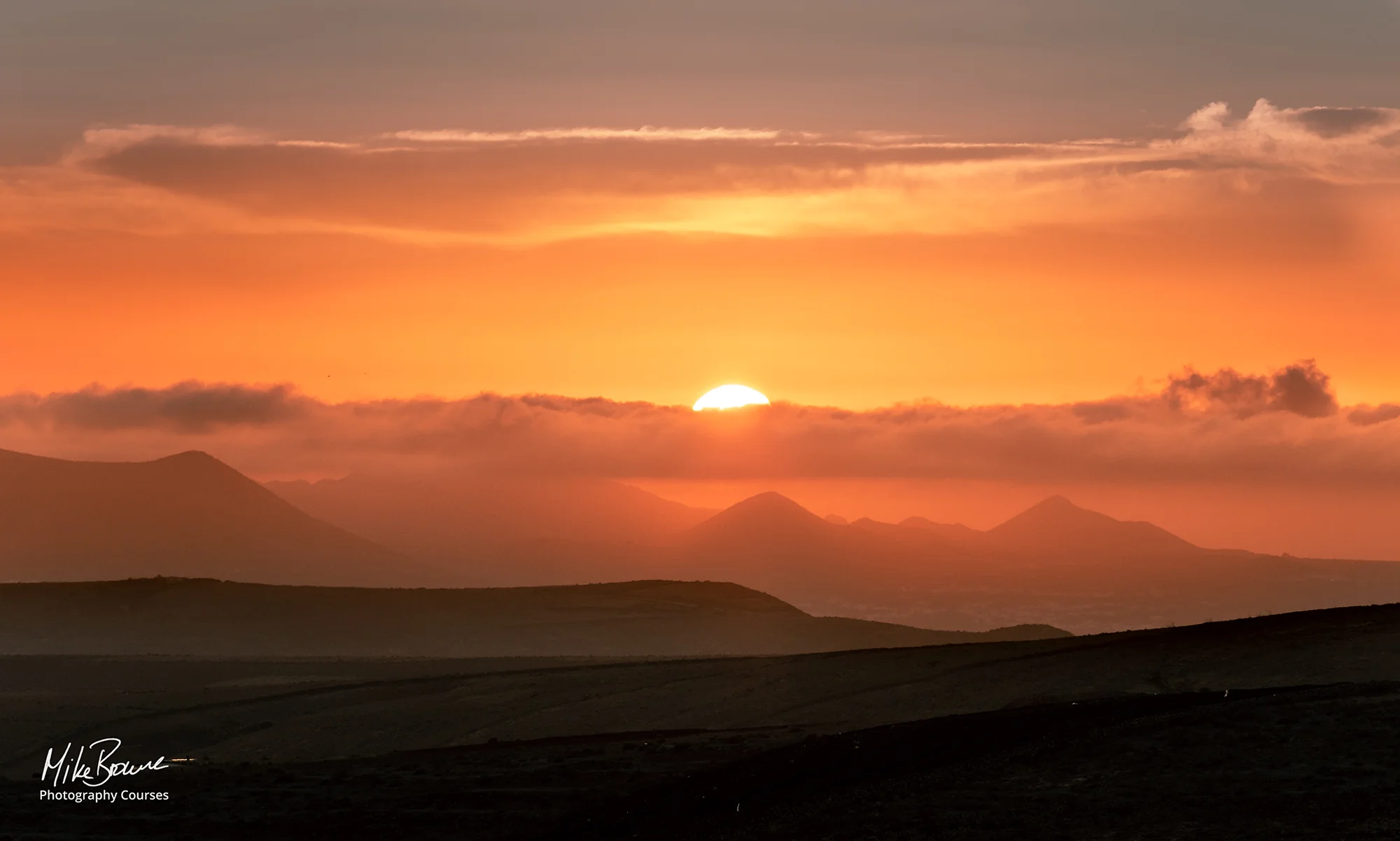 Hazy sunset over distant mountains near Haria, Lanzarote