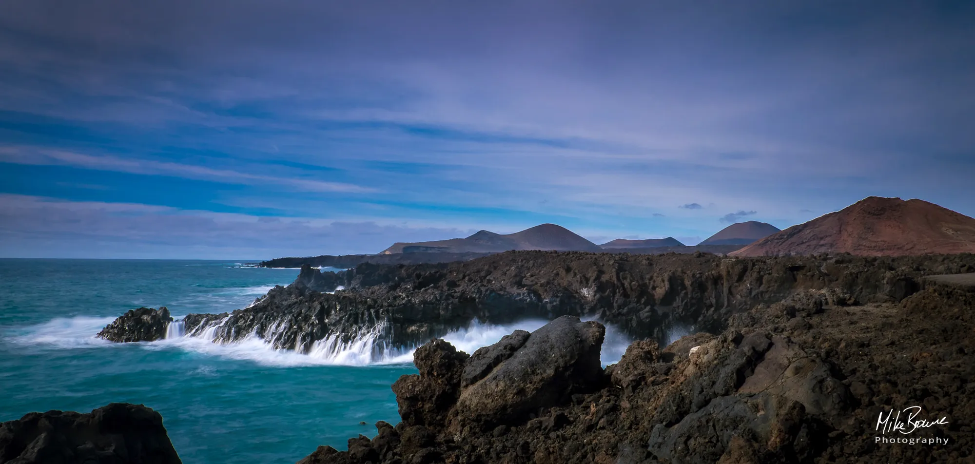 Sea water cascading down rocks on the coast of Lanzarote near Los Hervidores