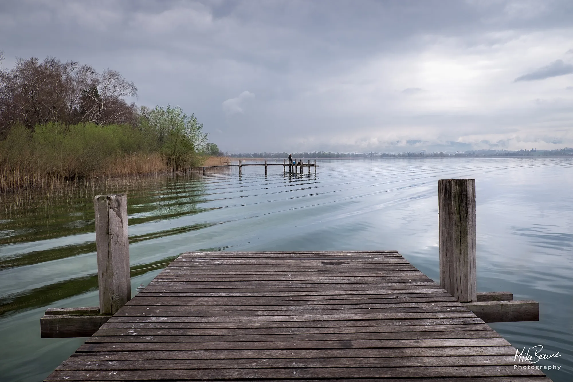 Wooden docks and ripples on lake Pfäffikersee Switzerland