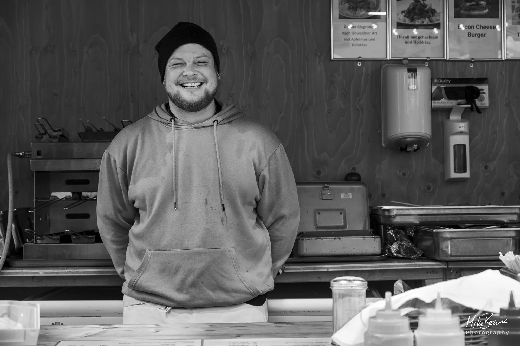 Smiling street food seller with a beard in Zurich