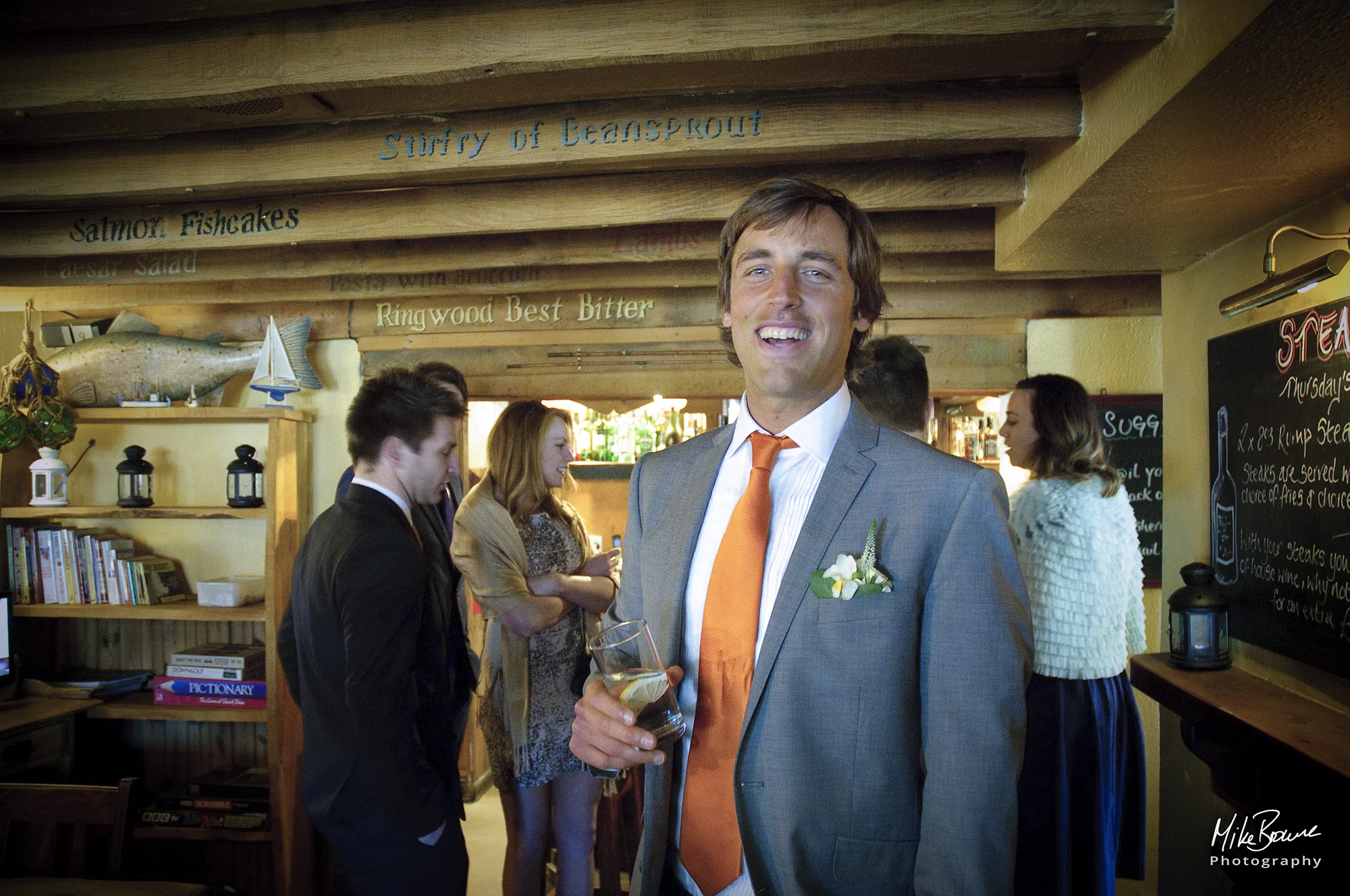 Man about to be married having pre wedding drink with guests in a pub