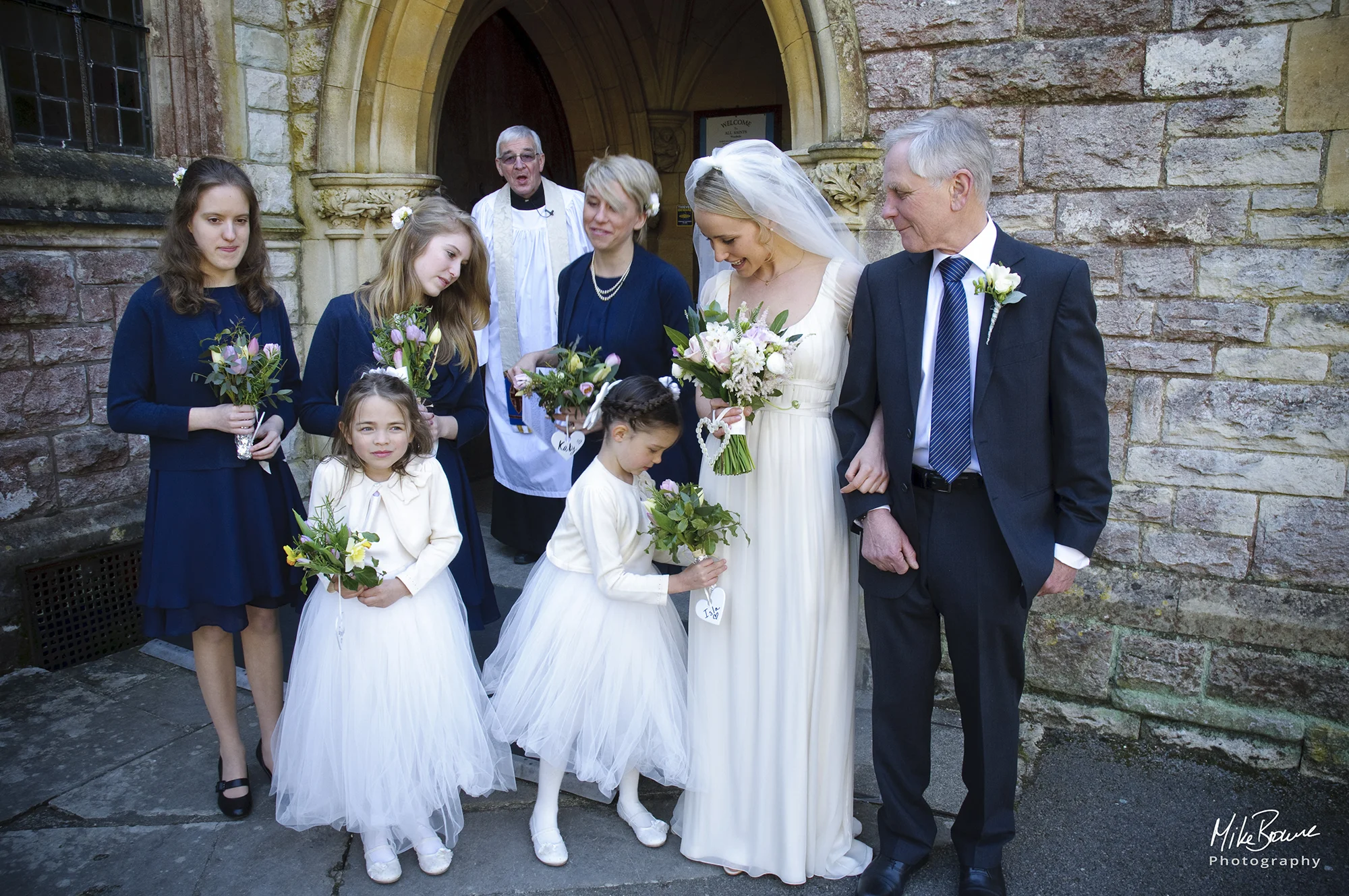 Vicar looks surprised as smallest bridesmaid wants to change her flowers