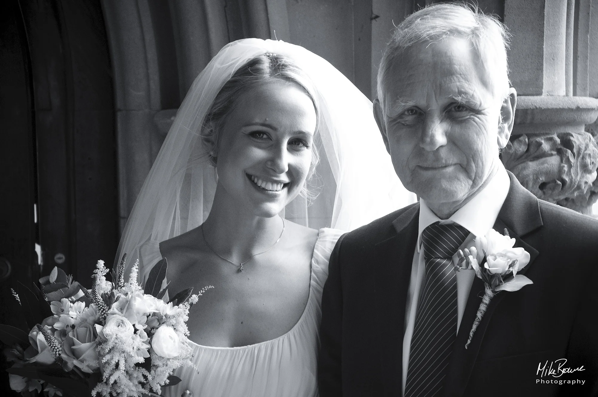 Beautiful Bride and her father smile for the camera